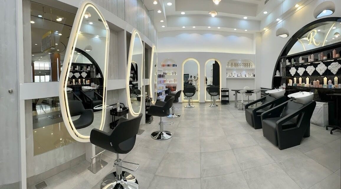 Modern interior of Wissam Al Farah Beauty Lounge, Dubai, with chic styling stations and elegant design.