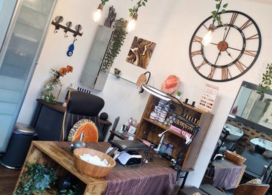 Interior view of A.S.H Beauty at Maine Salon in Huddersfield, England, GB, showcasing a modern styling area.