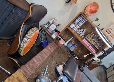 Nail art station at A.S.H Beauty at Maine Salon, Huddersfield, England, GB, showcasing tools and products.