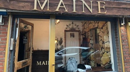 Exterior view of A.S.H Beauty at Maine Salon in Huddersfield, England, GB, showcasing rustic aesthetics.