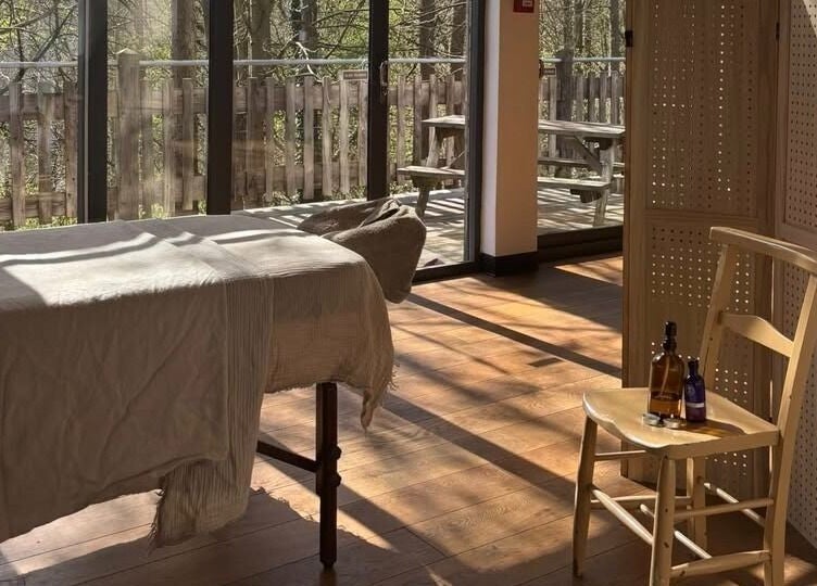 Inviting massage room at New Chapter Massage, Larchwood Studio, Hay-on-wye, Wales, GB with natural light.