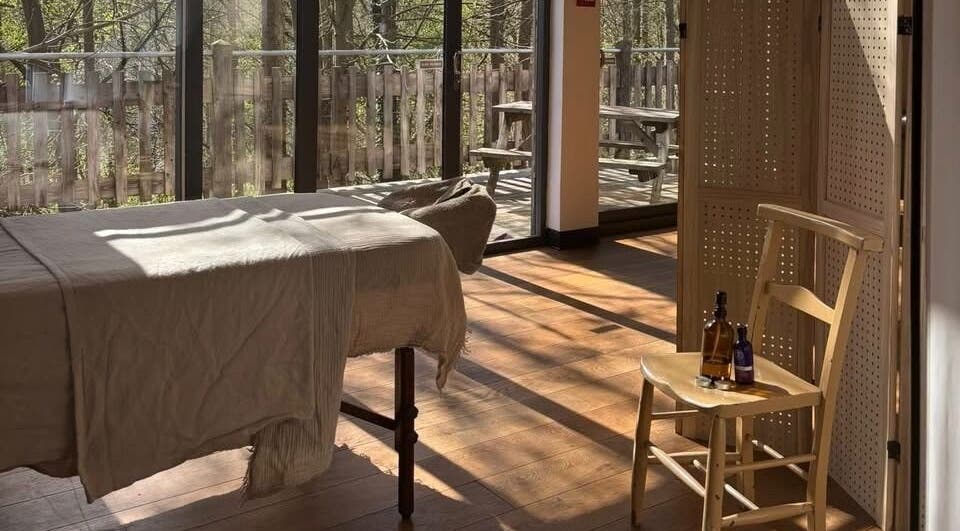 Inviting massage room at New Chapter Massage, Larchwood Studio, Hay-on-wye, Wales, GB with natural light.
