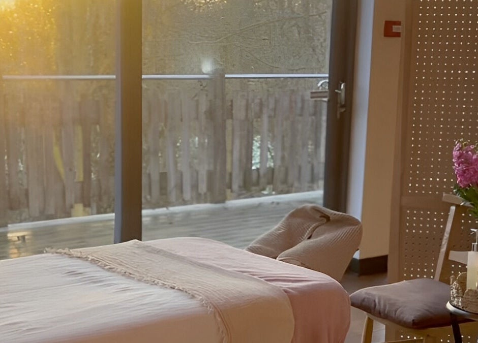 Relaxing massage setup at New Chapter Massage at Larchwood Studio, Hay-on-wye, Wales, GB, bathed in warm sunlight.