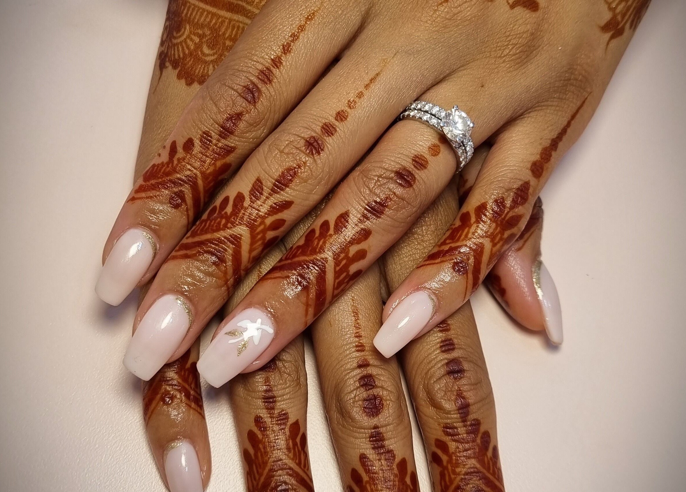 Beautiful henna design and polished nails at Chique Nail Studio in London, England, GB.