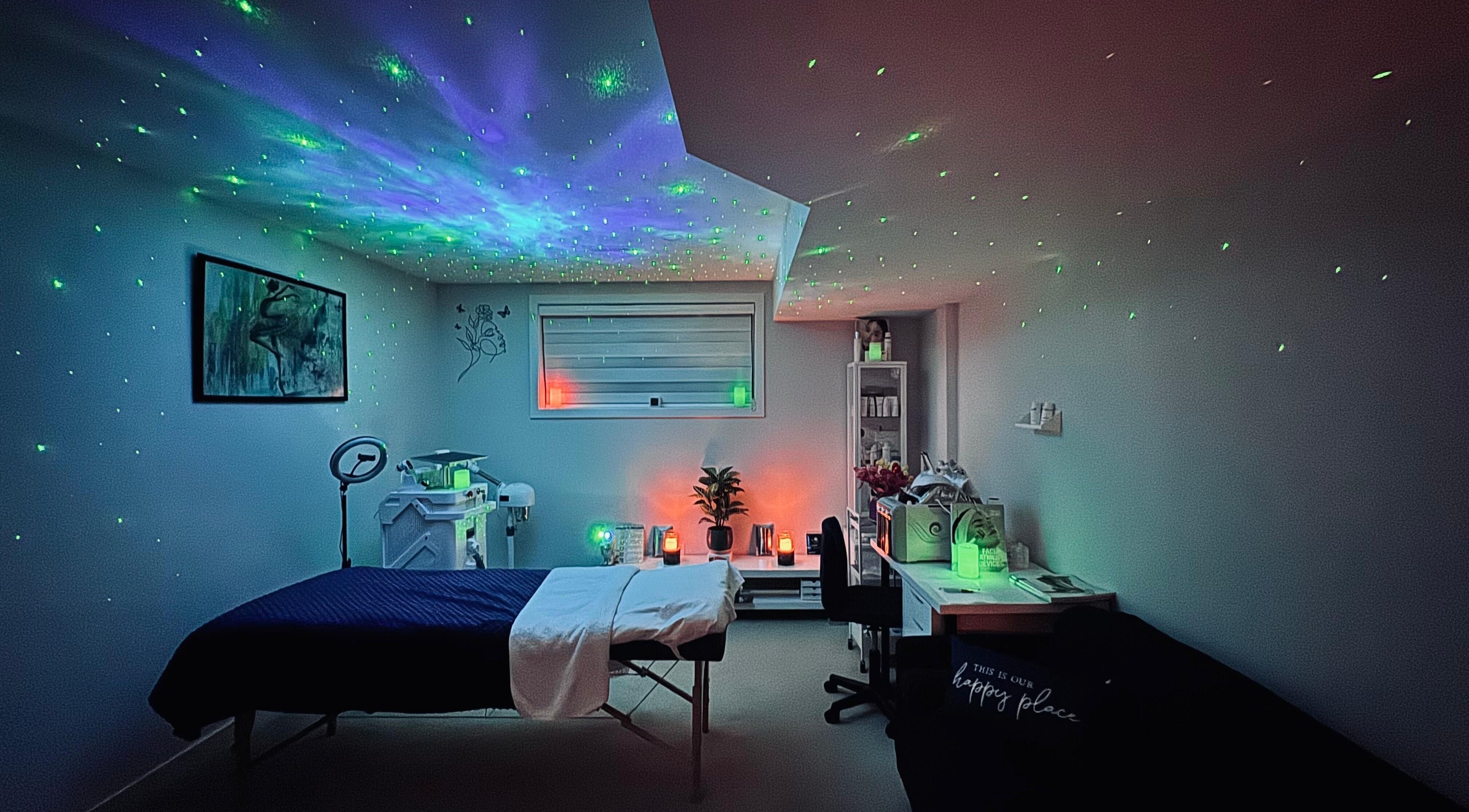 Relaxing spa room at SunMoon Beauty in Ottawa, Ontario, CA with starry ceiling lights and cozy decor.