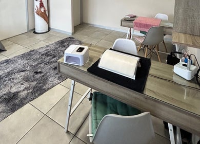 Elegant nail care station at Ninnie's, Boksburg, Gauteng, ZA, featuring modern decor and a cozy atmosphere.