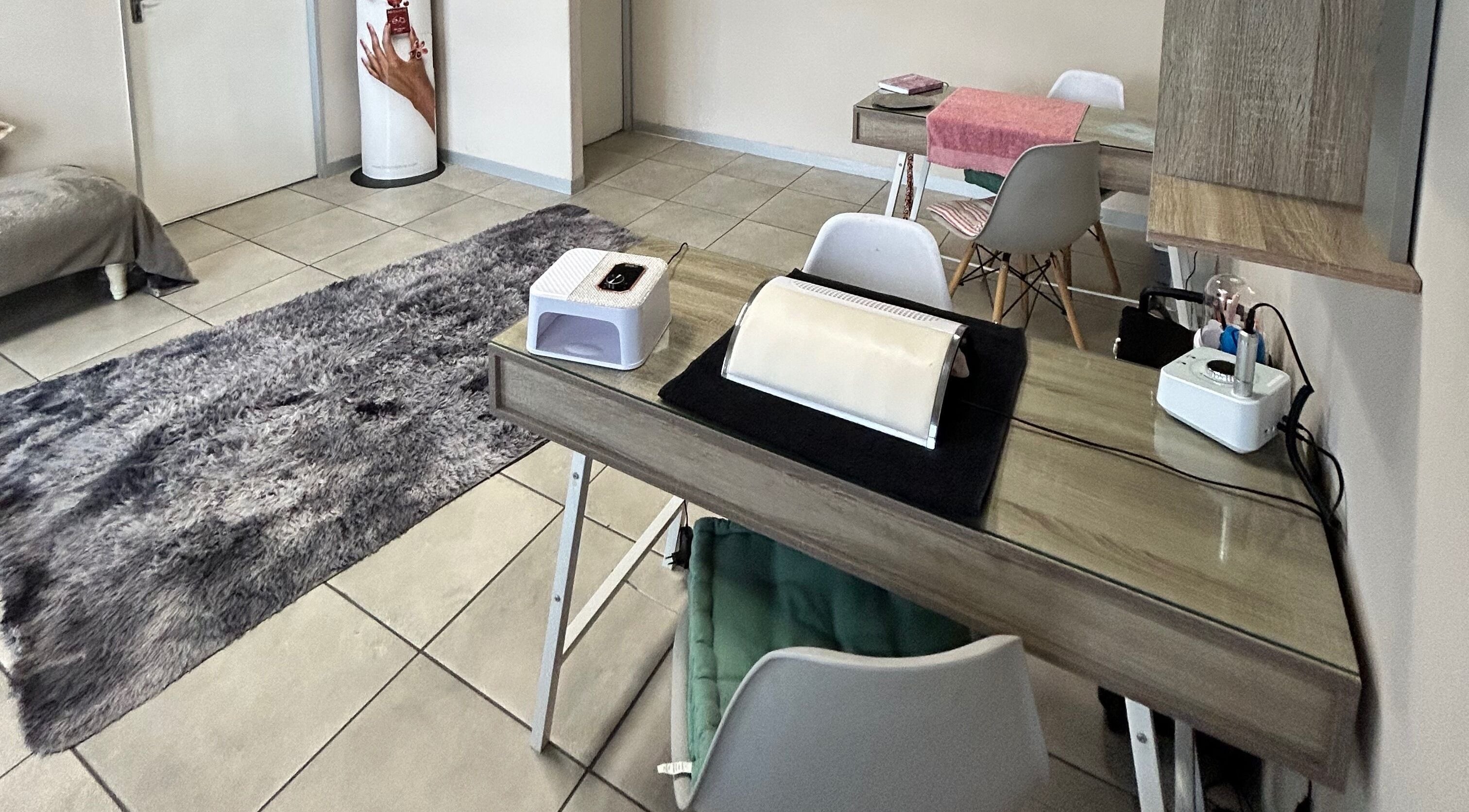 Elegant nail care station at Ninnie's, Boksburg, Gauteng, ZA, featuring modern decor and a cozy atmosphere.