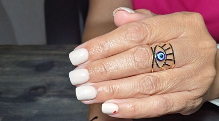 Elegant pale nails with unique ring at Ninnie's, Boksburg, Gauteng, ZA.