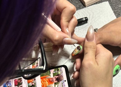 Intricate nail art in progress at Ninnie's, Boksburg, Gauteng, ZA, showcasing skilled artistry.