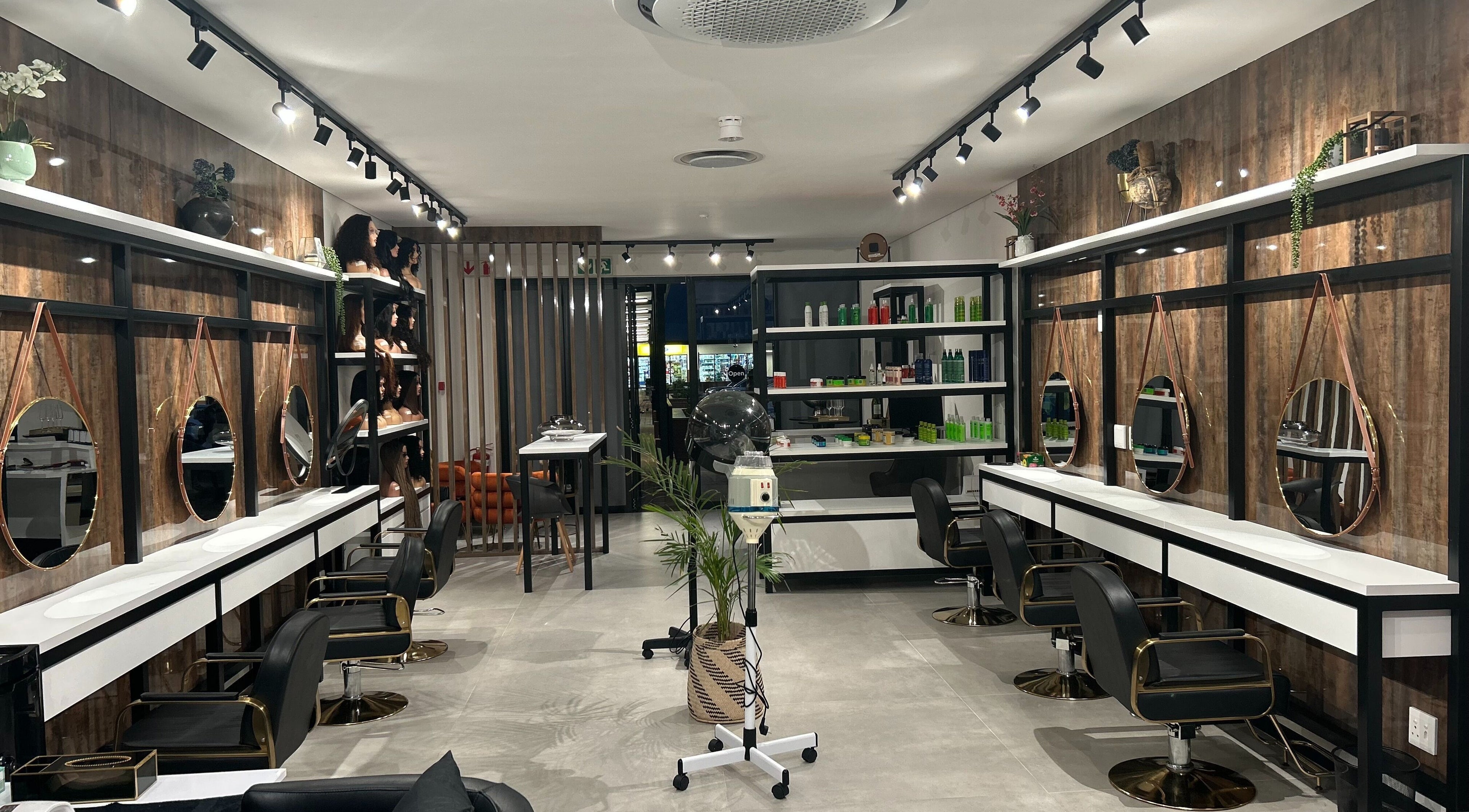 Modern and stylish interior of Mbokodo Hair Salon in Sandton, Gauteng, ZA with sleek furniture and decor.