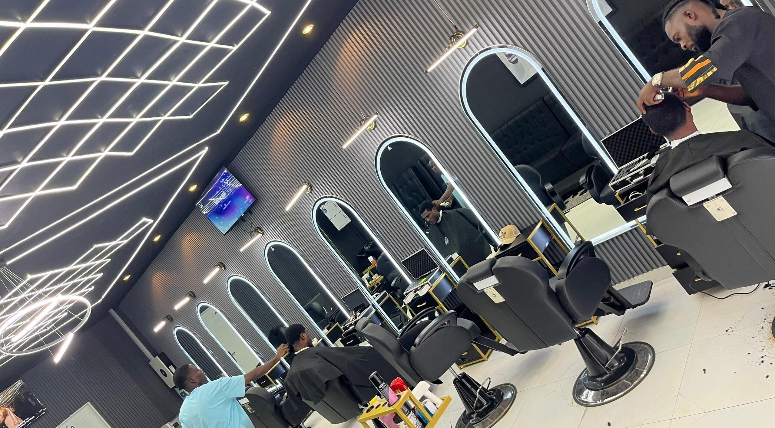 Modern barber chairs and mirrors at Chillz Place & Barbershop APO Abuja, Abuja, Federal Capital Territory, NG.