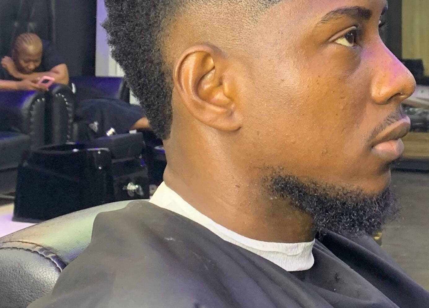Detailed close-up of a man's haircut at Bayelsa, Yenagoa, Bayelsa, NG showing a crisp, modern style.