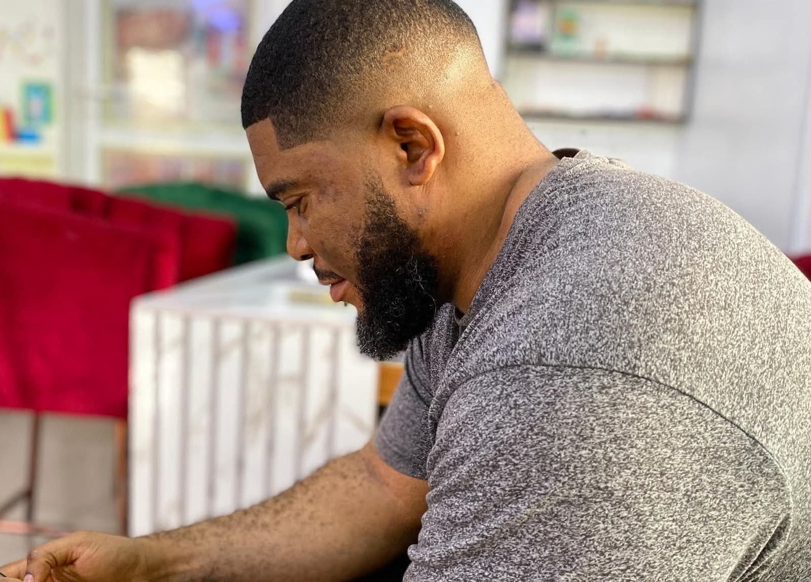 Man relaxing in a cozy venue at Bayelsa, Yenagoa, Bayelsa, NG showcasing serene ambiance.