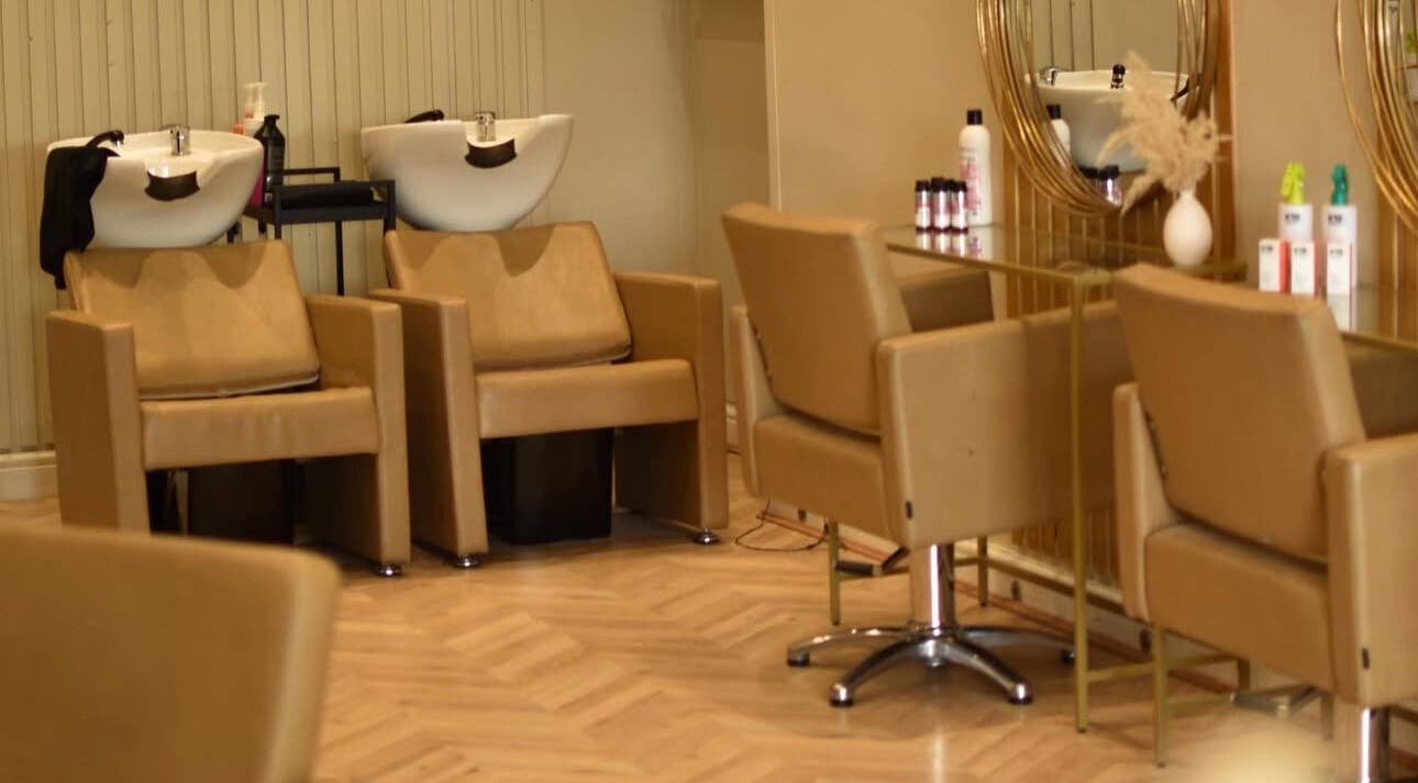 Sleek hair salon interior at Indiaolivia Hair, Wallasey, England, GB, showcasing modern amenities and style.