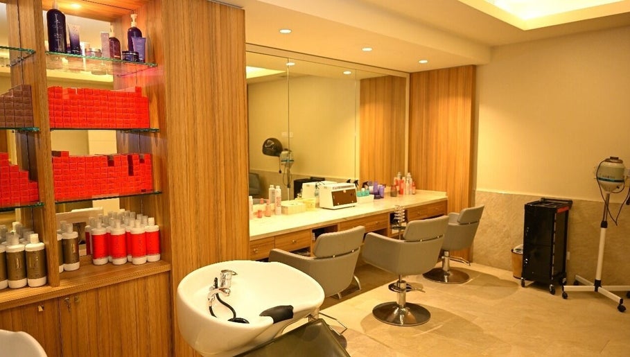 Elegant salon at Ezees Beauty & Spa, Al Khobar, Eastern Province, SA, showcasing modern chairs and products.