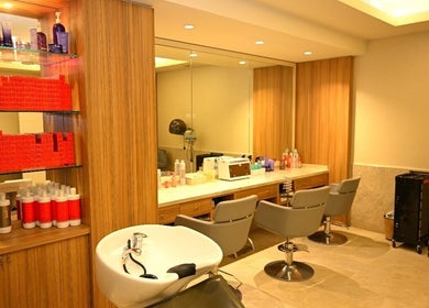 Elegant salon at Ezees Beauty & Spa, Al Khobar, Eastern Province, SA, showcasing modern chairs and products.
