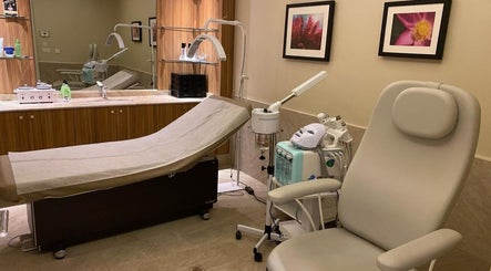 Relaxing treatment room at Ezees Beauty & Spa, Al Khobar, Eastern Province, SA, with modern equipment.