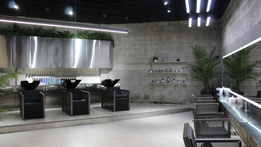 Modern salon interior with sleek chairs and mirrors at Paintbox Hair Studio, Dubai, Dubai, AE.