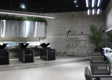 Modern salon interior with sleek chairs and mirrors at Paintbox Hair Studio, Dubai, Dubai, AE.