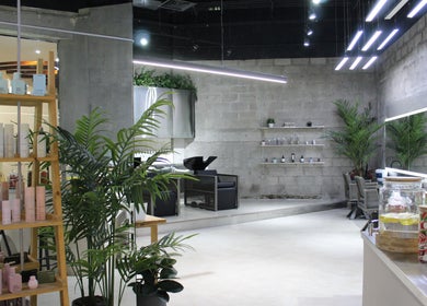 Interior of Paintbox Hair Studio in Dubai, Dubai, AE, featuring modern decor and stylish product display.