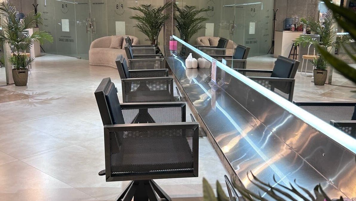 Modern styling chairs and elegant decor at Paintbox Hair Studio, Dubai, Dubai, AE, showcasing sleek design.
