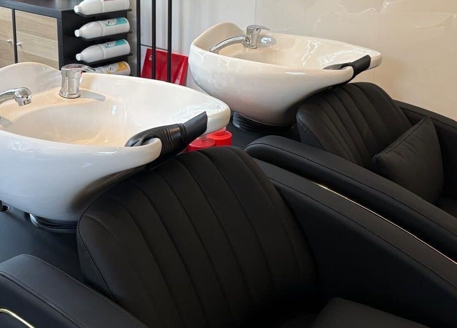 Modern wash basins at Hair By Milly Rose in Basingstoke, England, GB, offering a luxurious haircare experience.