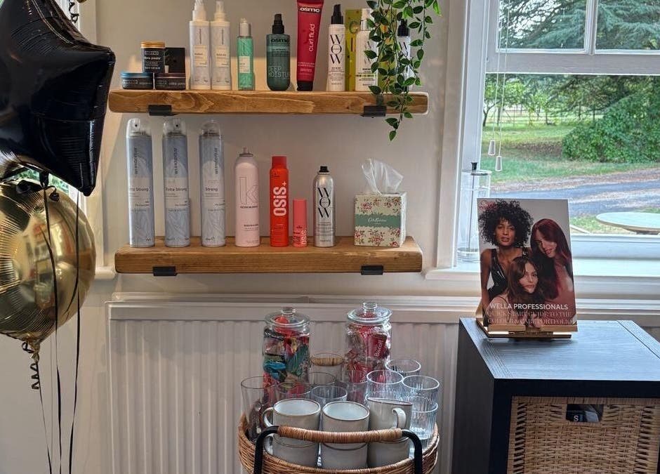Hair By Milly Rose, Basingstoke, England, GB salon with hair products and stylish decor on wooden shelves.