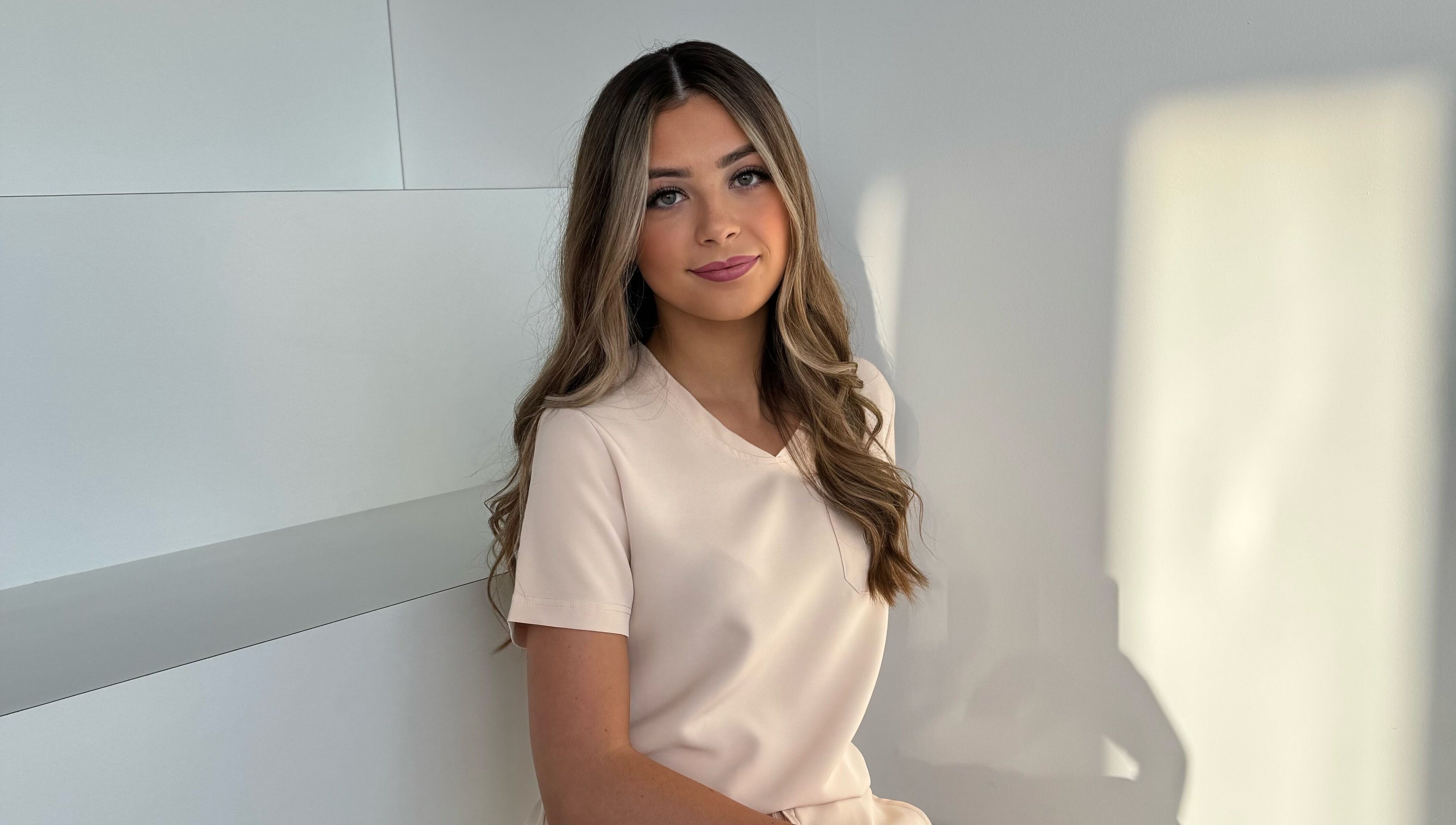 Smiling person at By Amelia, Thurmaston, England, GB, creating a warm and inviting atmosphere.