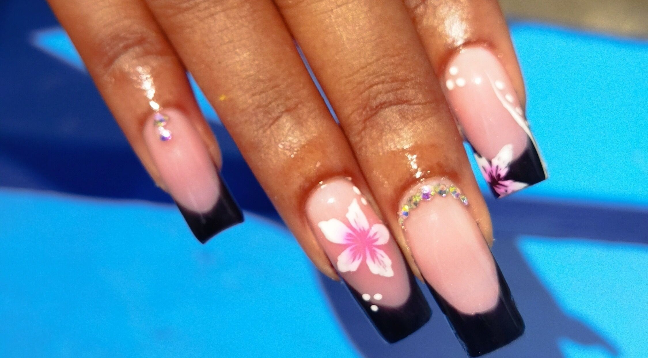 Beautiful floral nail art at Nail Therapy, Laborie, Laborie, LC showcasing intricate designs.