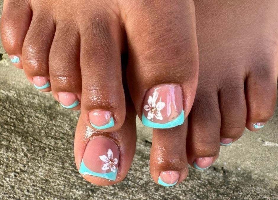 Elegant floral nail art on toes at Nail Therapy, Laborie, Laborie, LC, showcasing intricate design finesse.