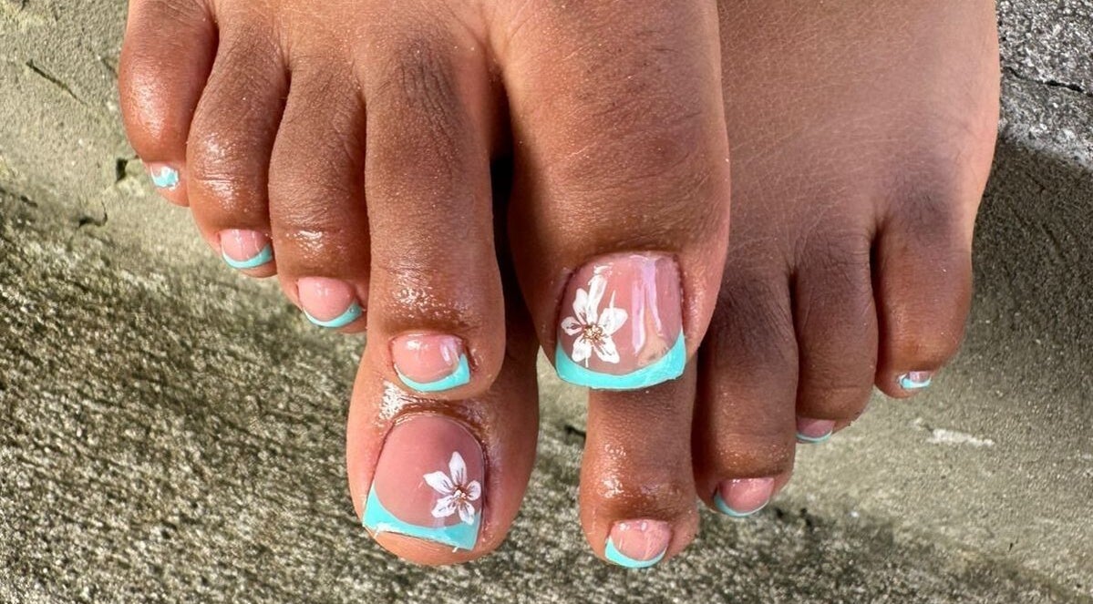 Elegant floral nail art on toes at Nail Therapy, Laborie, Laborie, LC, showcasing intricate design finesse.