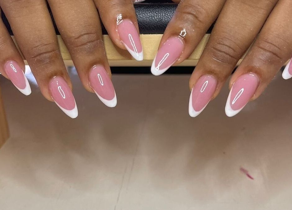 Elegant French manicure at Nail Therapy, Laborie, Laborie, LC featuring pink nails with white tips.