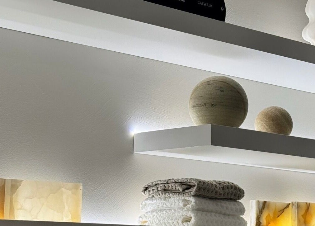 Elegant shelf with soft lighting and decor at E Lash Atelier, Merrylands West, New South Wales, AU.