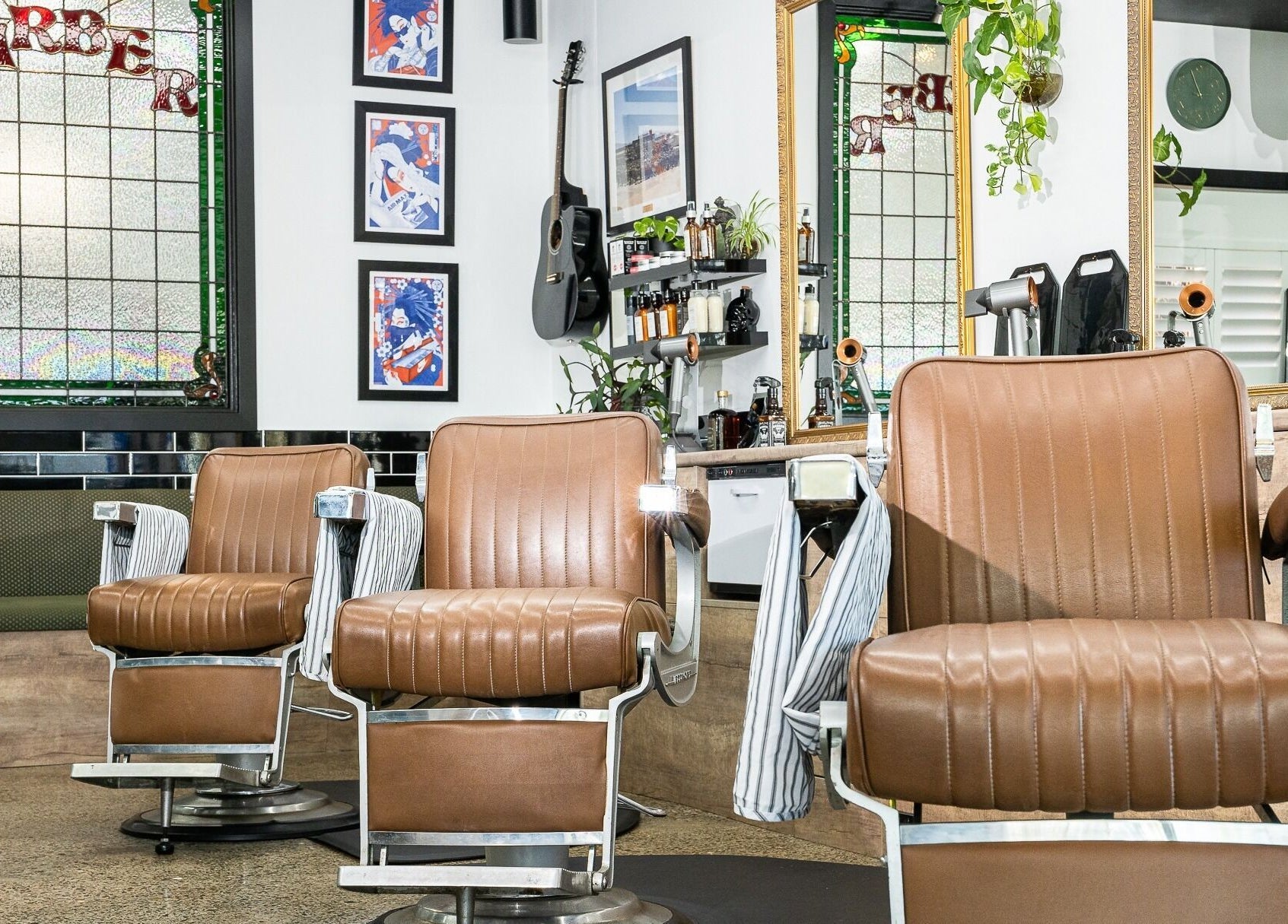 Vintage barber chairs at Broken Hearts Barbershop, Port Macquarie, New South Wales, AU with stylish decor.