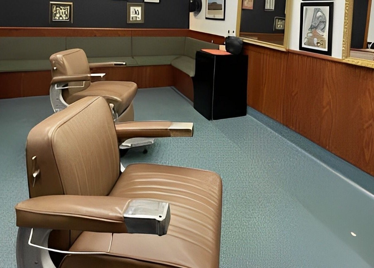 Cozy interior of Broken Hearts Barbershop in Port Macquarie, New South Wales, AU with vintage chairs and decor.