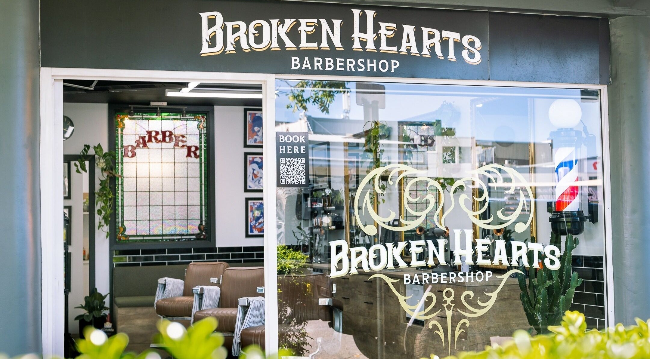 Exterior view of Broken Hearts Barbershop in Port Macquarie, New South Wales, AU with classic barber decor.
