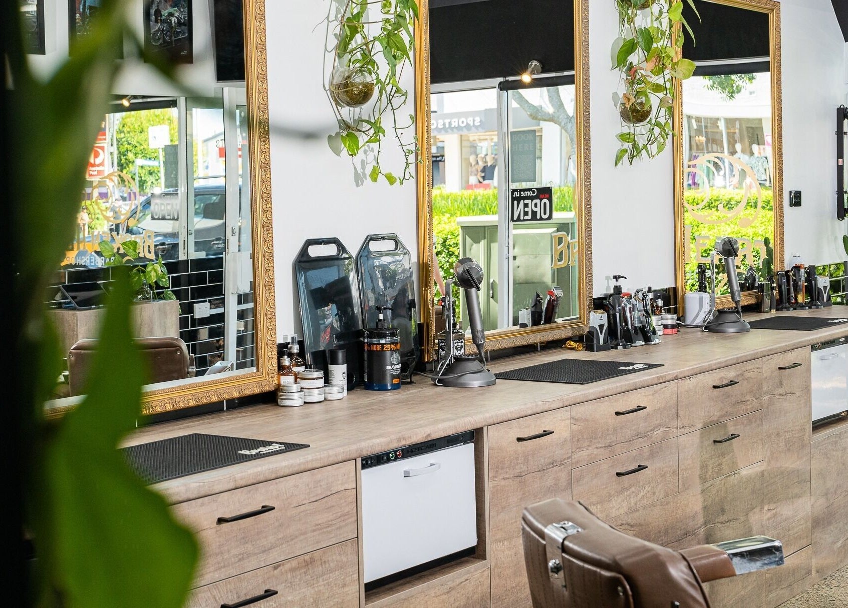 Elegant interior of Broken Hearts Barbershop, Port Macquarie, New South Wales, AU with stylish decor and mirrors.