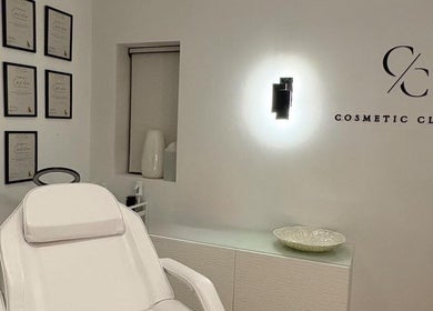 Modern treatment room at Cosmetic Clinic, Calverley, England, GB, with elegant decor and certification frames.