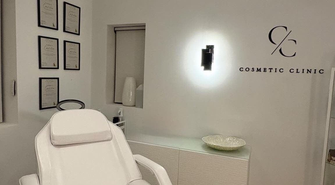 Modern treatment room at Cosmetic Clinic, Calverley, England, GB, with elegant decor and certification frames.