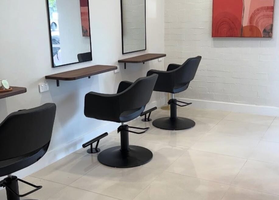 Modern salon interior at Gemma Gracie Hair Artistry in Applecross, Western Australia, AU with stylish black chairs.