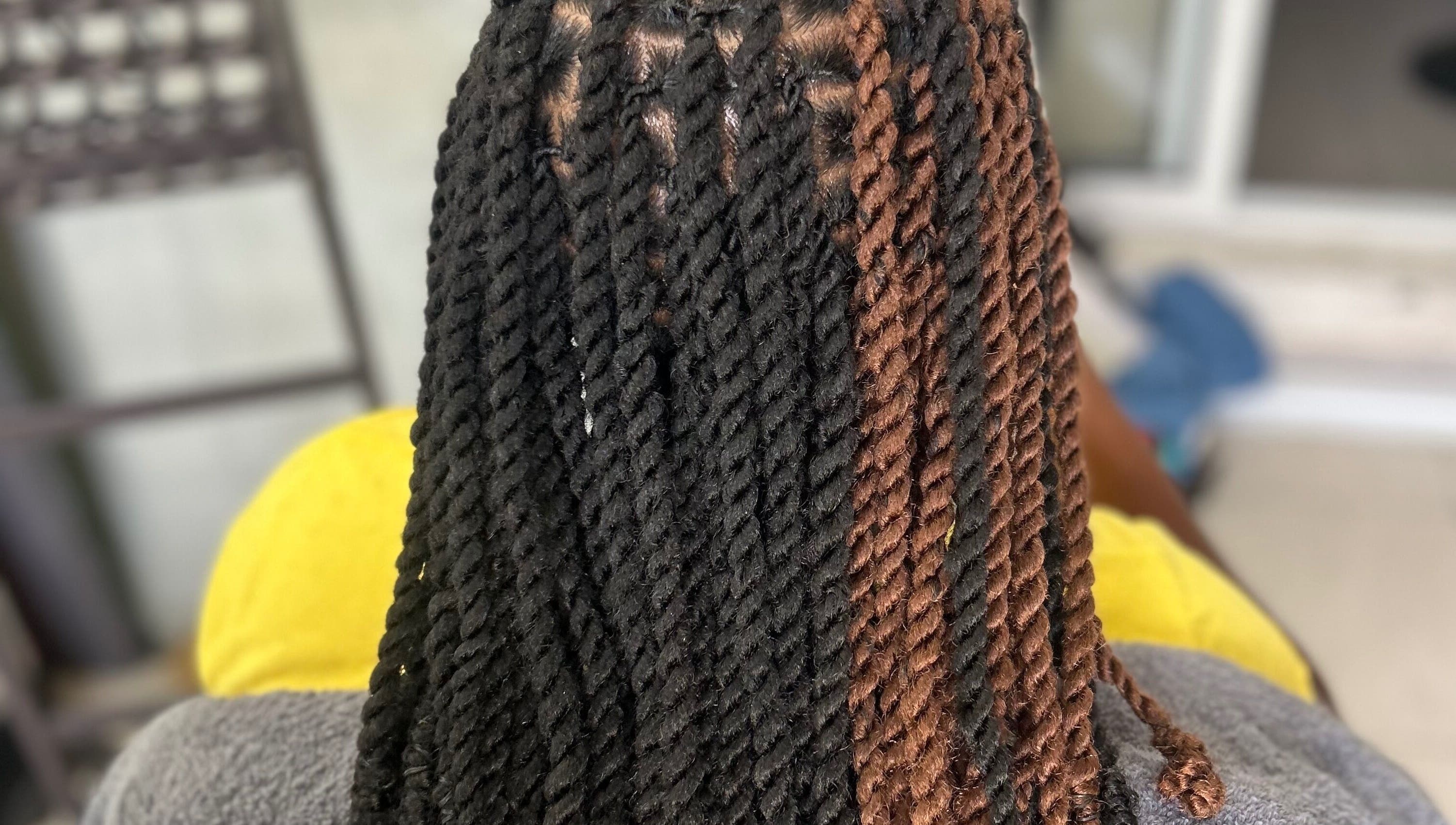 Intricate twist hairstyle at Styled by Tammy, Marigot, MF, showcasing expertly styled braids.