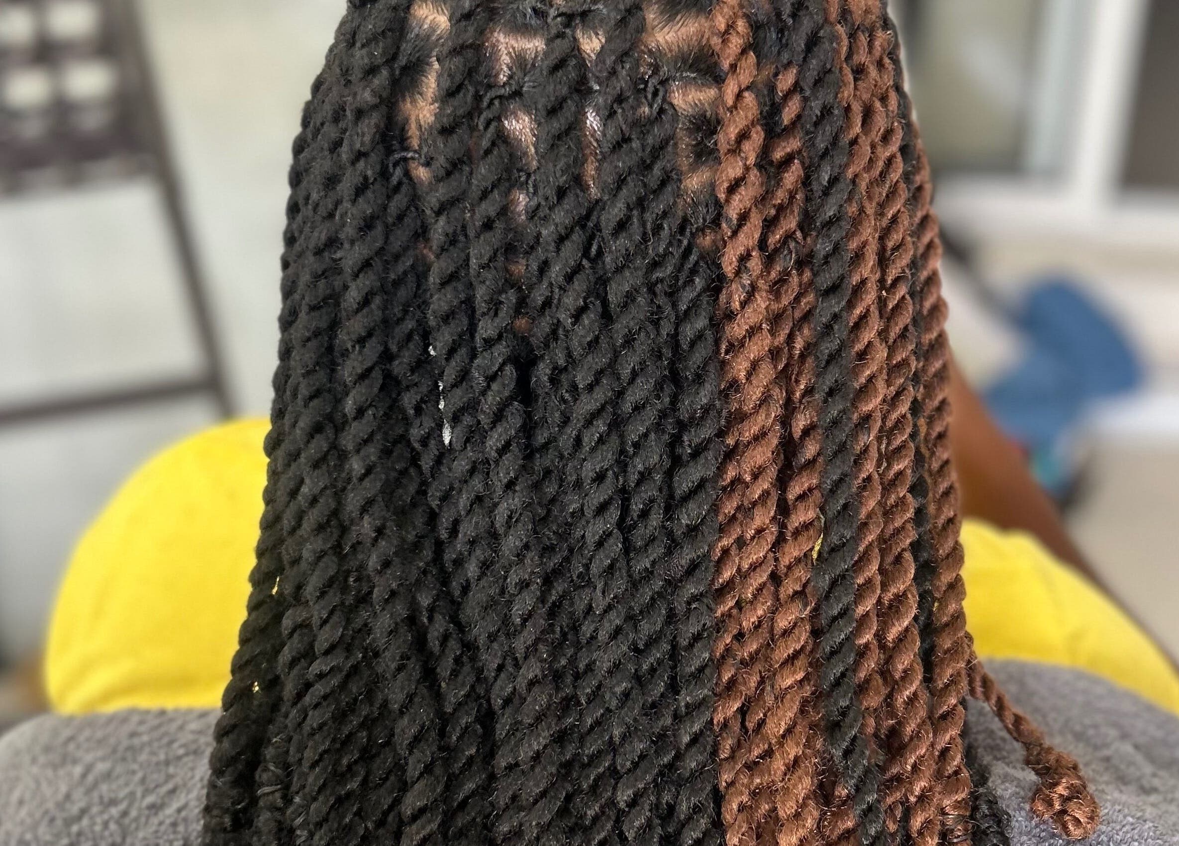 Intricate twist hairstyle at Styled by Tammy, Marigot, MF, showcasing expertly styled braids.