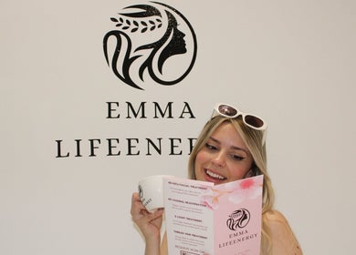 Customer enjoying brochure at Emma Lifeenergy In Milian London Beauty Salon, Beckenham, England, GB.