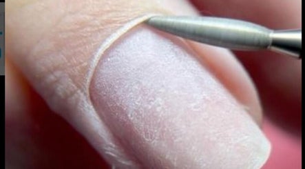 Close-up of nail grooming at Medi Nail Pro, Hong Kong, HK, showcasing precise manicure technique.