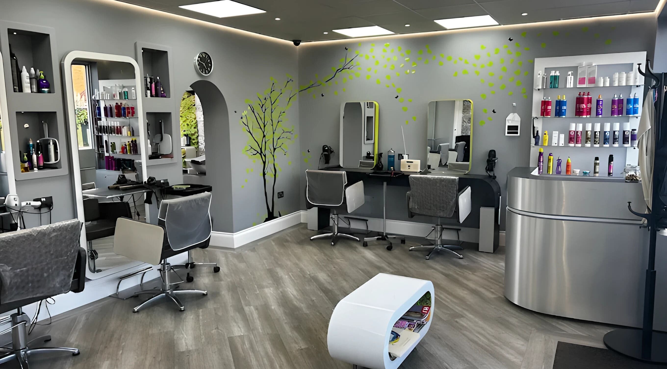 Bright, modern interior of Tangled Hair Studio in Bristol, England, GB, featuring sleek salon chairs and vibrant decor.