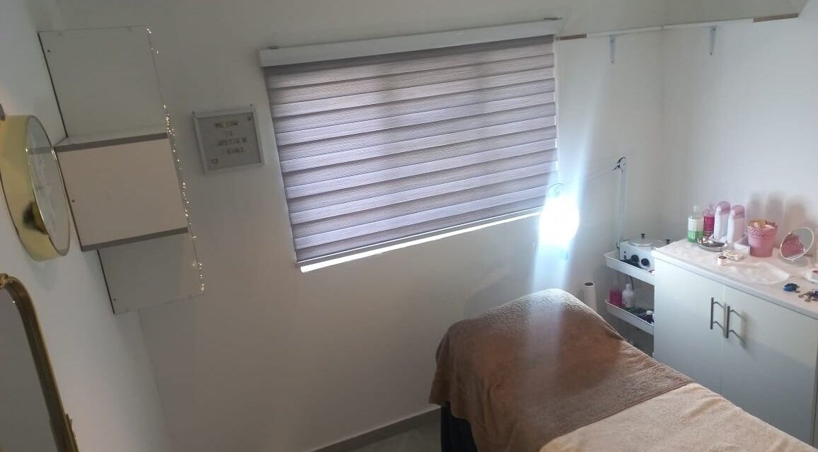 Relaxing spa room at Aesthetic Pearls, Johannesburg, Gauteng, ZA, featuring a massage bed and serene decor.