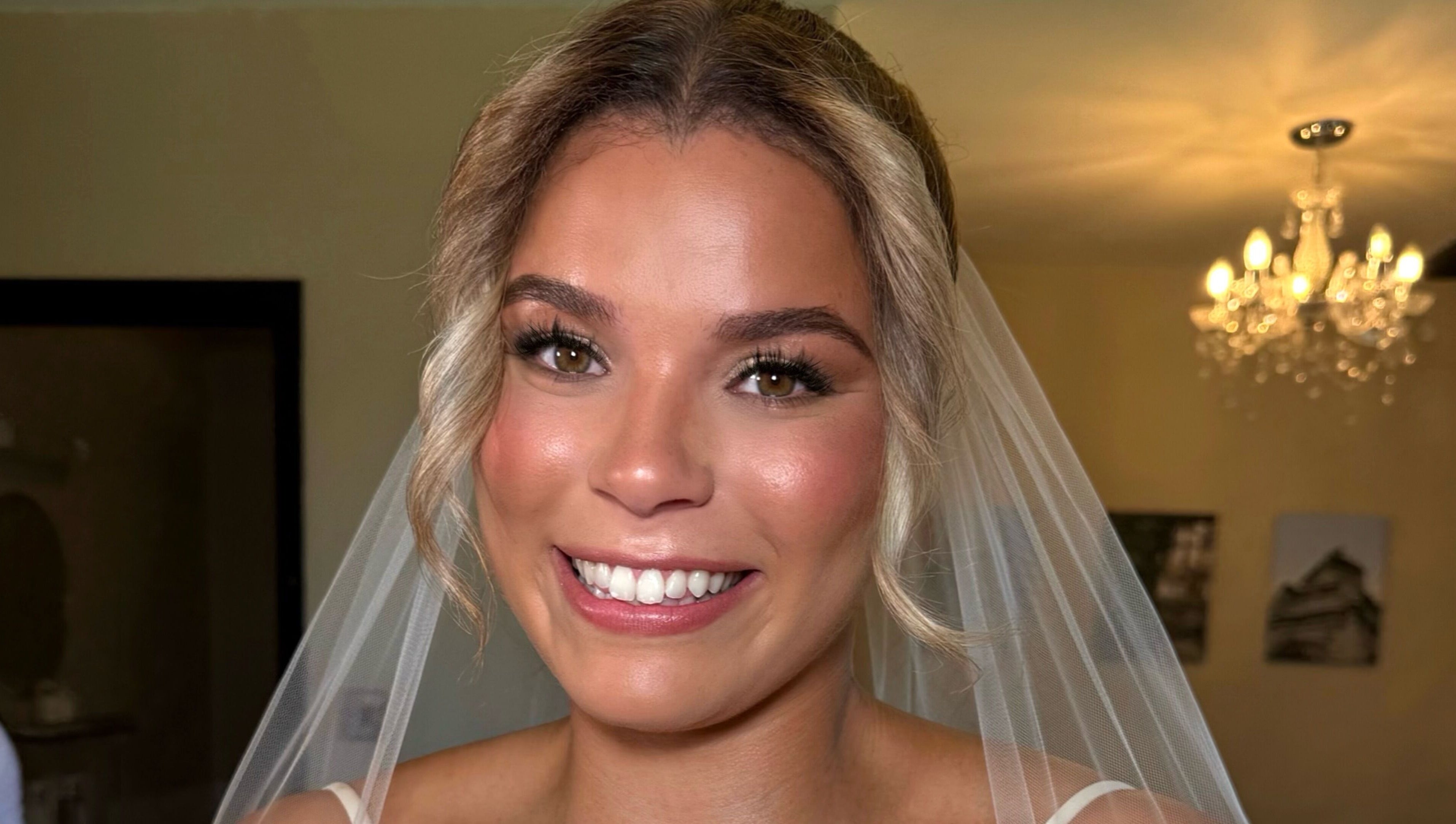 Beautiful bridal makeup by Olivia Caetano Make-up Artist in Bromley, England, GB. Radiant smile and stunning look.