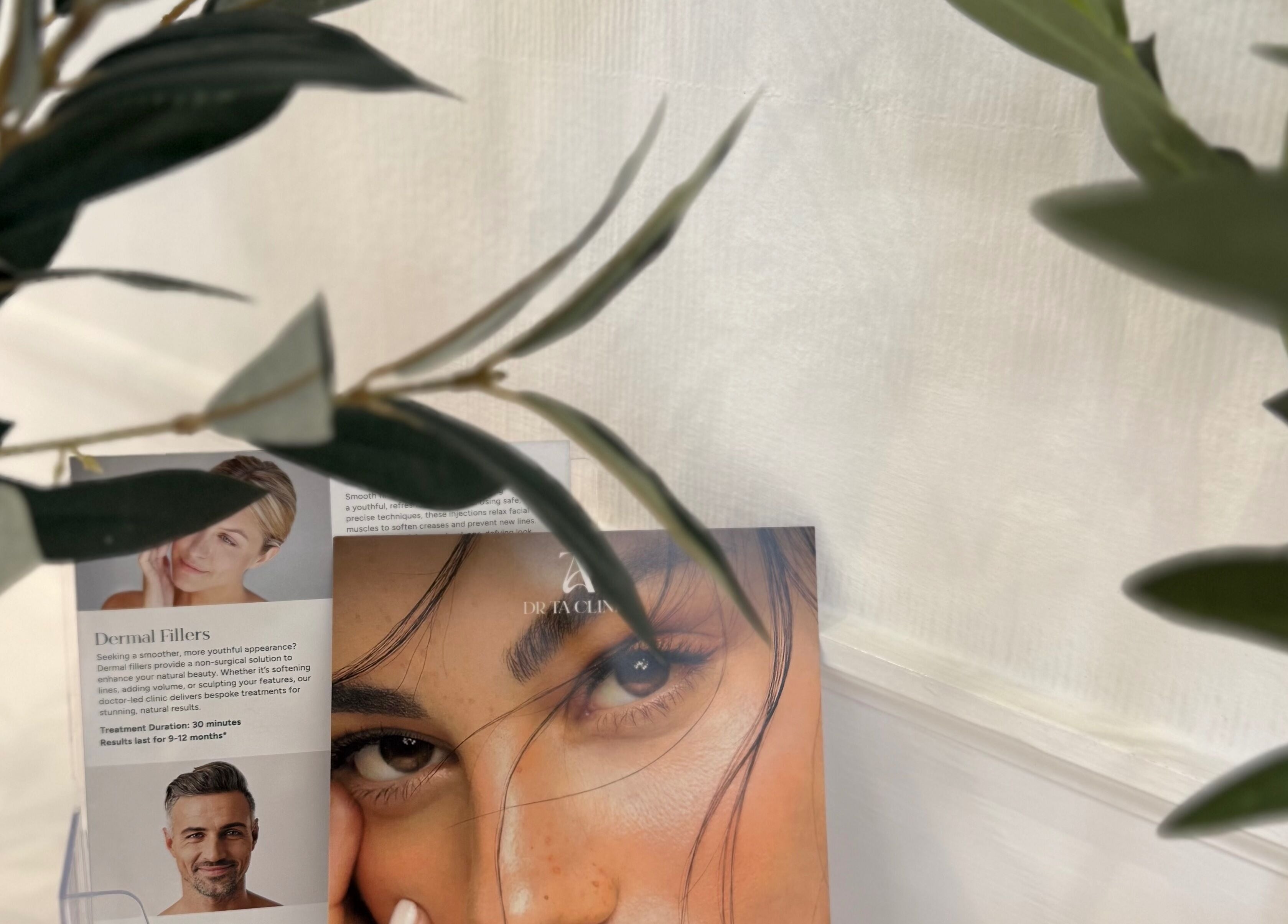 Promotional banner for dermal fillers at DrTA Clinic, Bathpool, England, GB, adorned with natural greenery.
