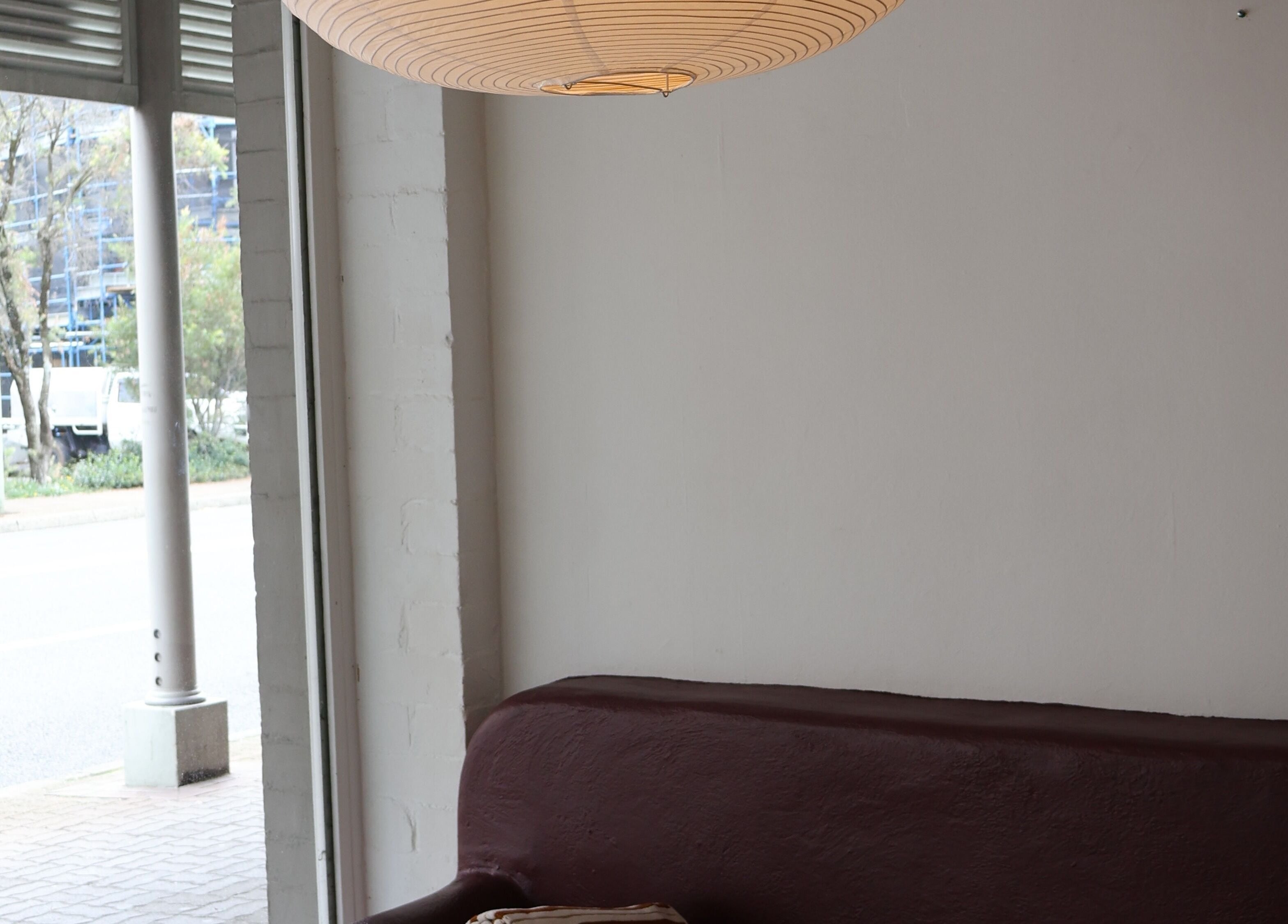 Cozy lounge area inside Nimbus Co Queenscliff, Manly, New South Wales, AU, with modern decor and window view.