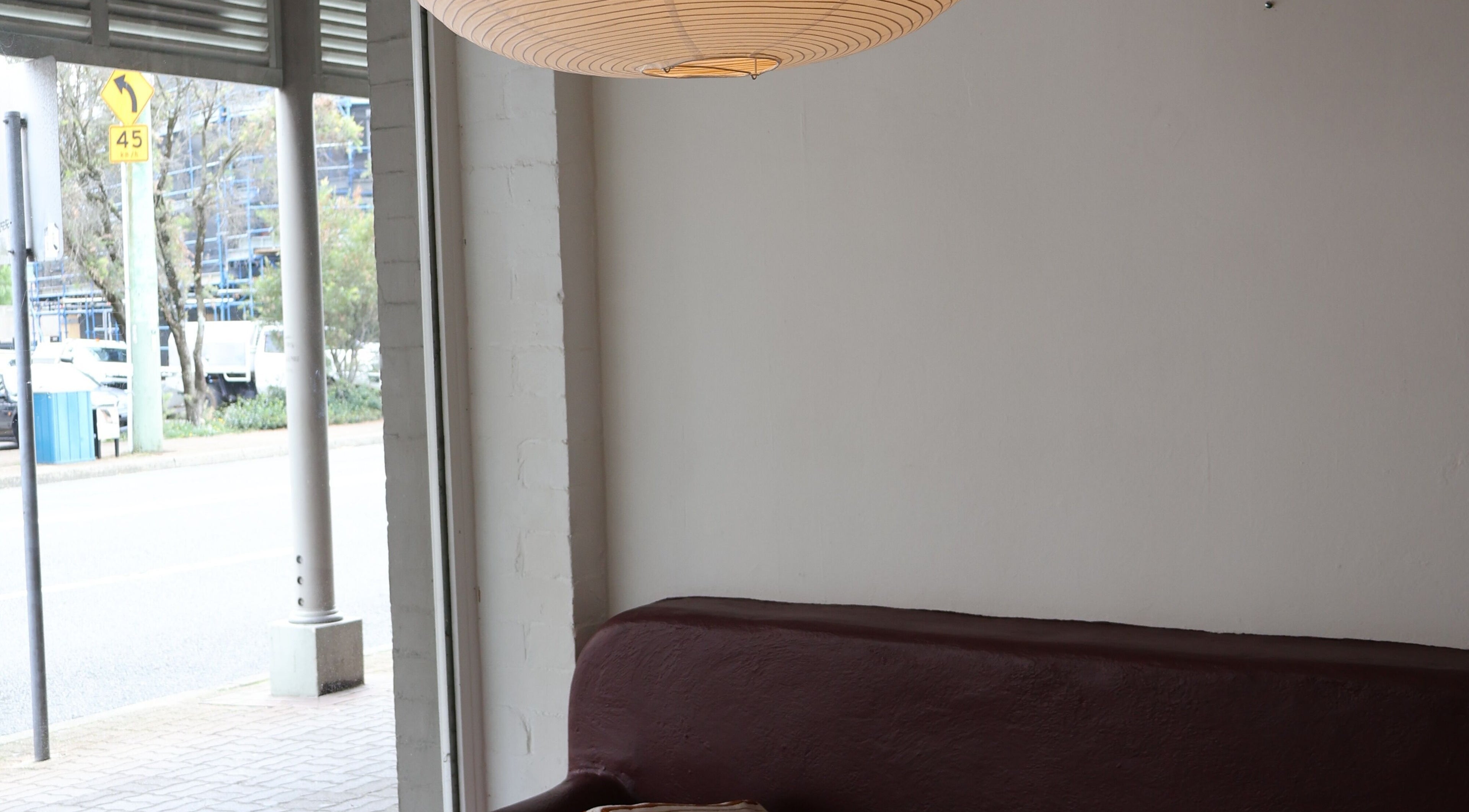 Cozy lounge area inside Nimbus Co Queenscliff, Manly, New South Wales, AU, with modern decor and window view.